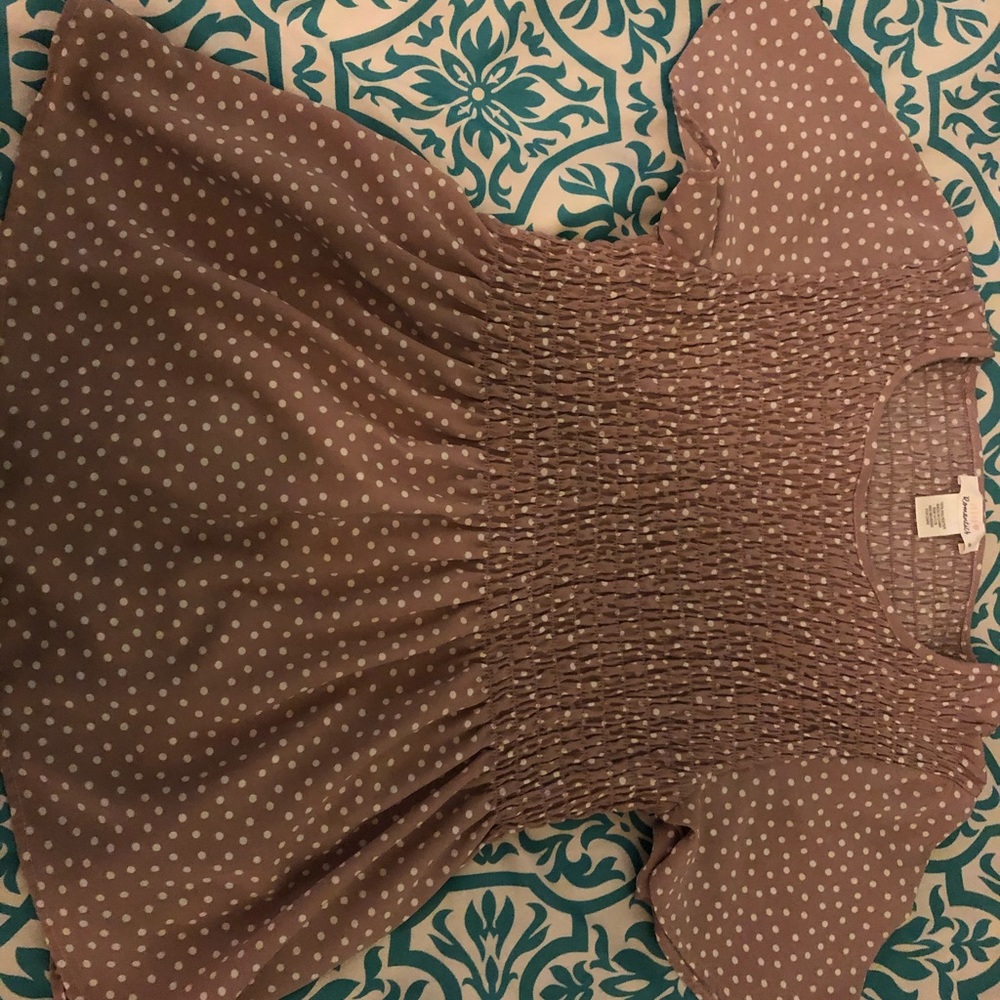 Pinkish tan blouse.